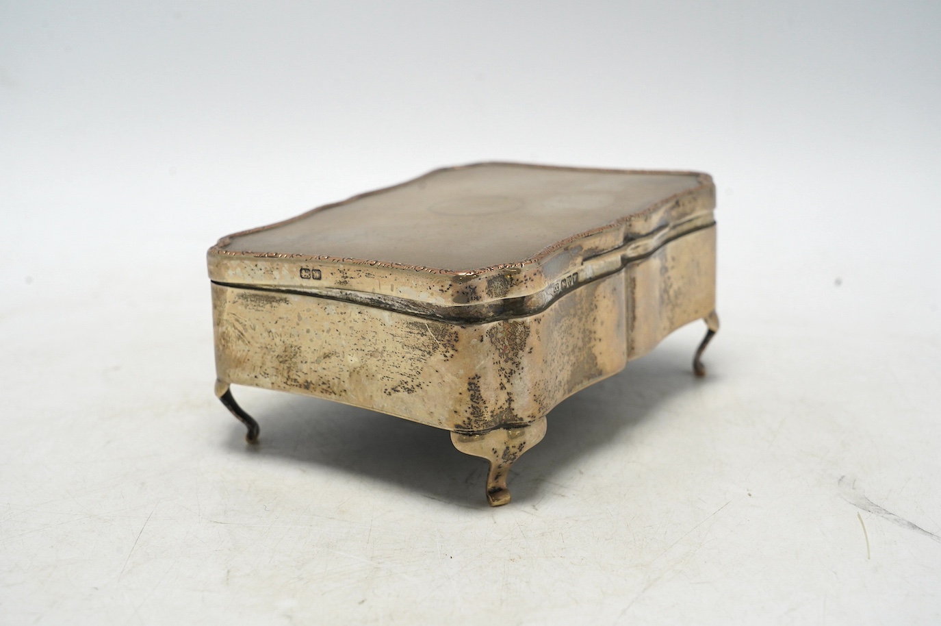 A George V silver mounted rectangular trinket box, by Colen Hewer Cheshire, Chester, 1922, 14cm. Condition - fair to poor